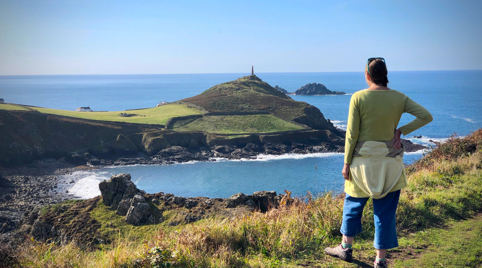Artist Joanne Short standing on the cliffs overlooking Cape Cornwall