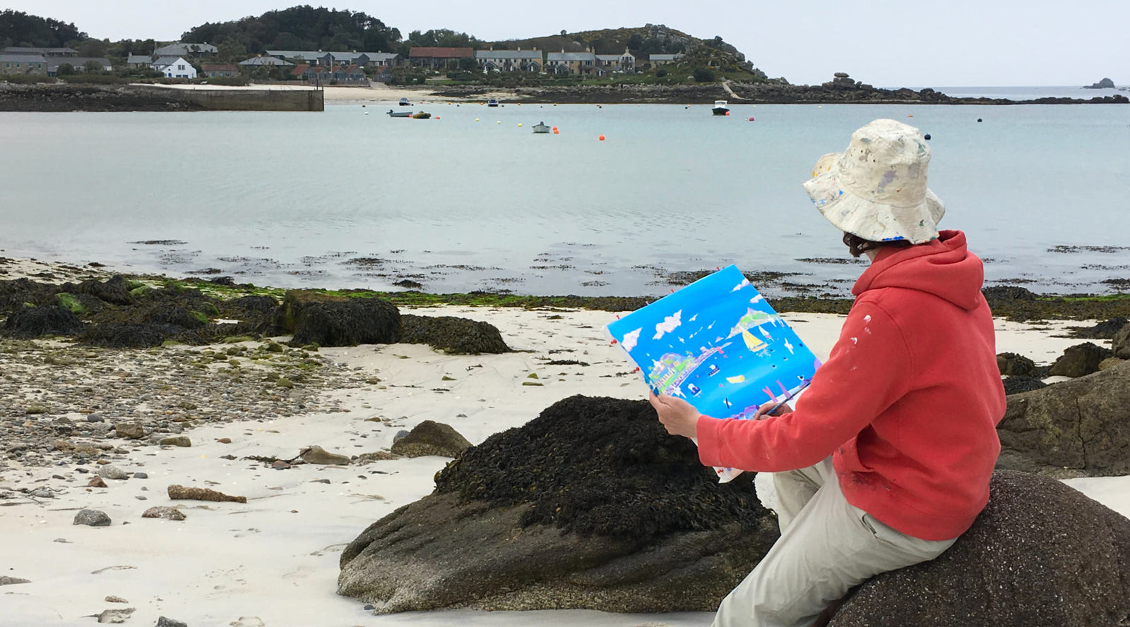 Cornwall artist John Dyer at work painting the sea on Tresco, Cornwall
