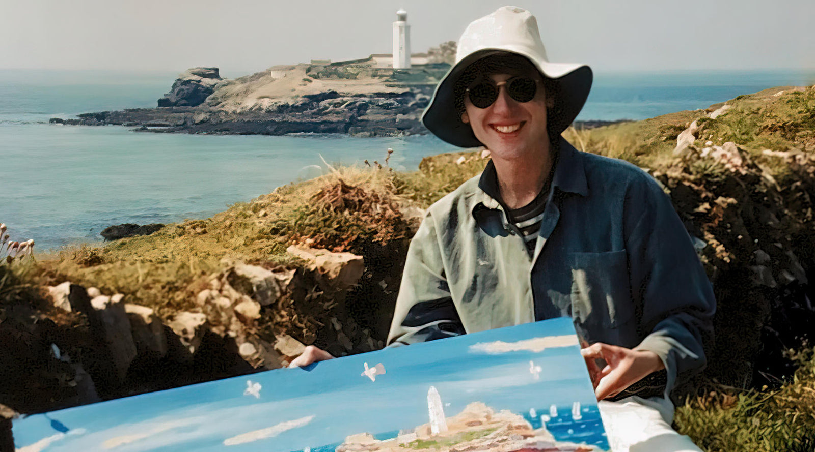 Cornish landscape artist John Dyer painting pictured at Godrevy lighthouse in the 1990s