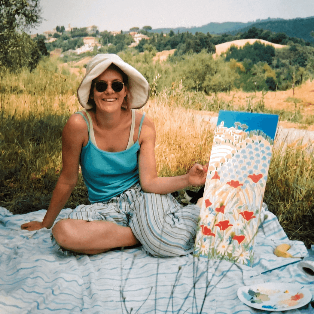 British artist Joanne Short, the UK's leading colourist oil painter, pictured in Italy working en plein air on an oil painting of the Italian landscape.