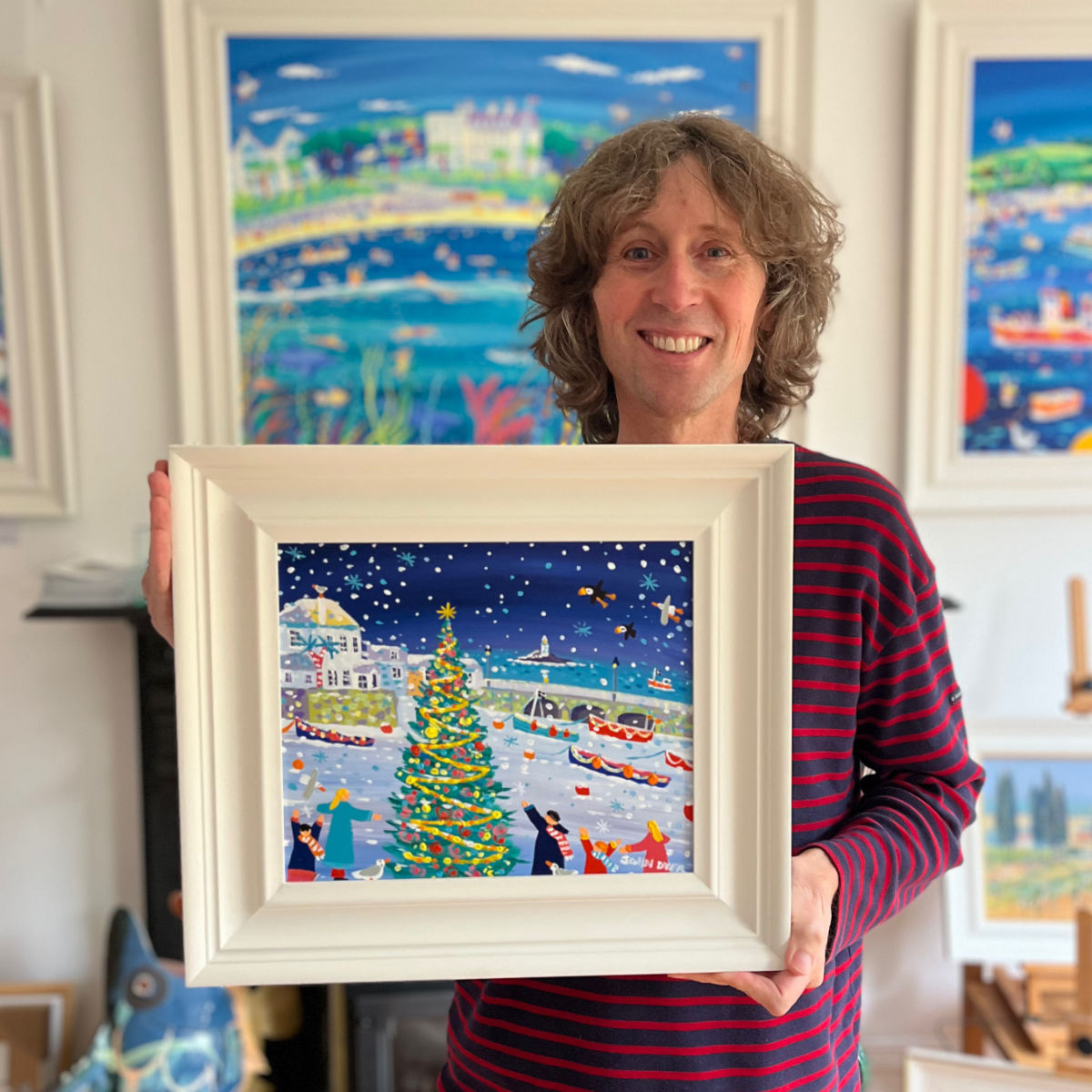 Cornish artist John Dyer pictured holding his painting 'Winter Wonderland, St Ives', 10x12 inches acrylic on canvas