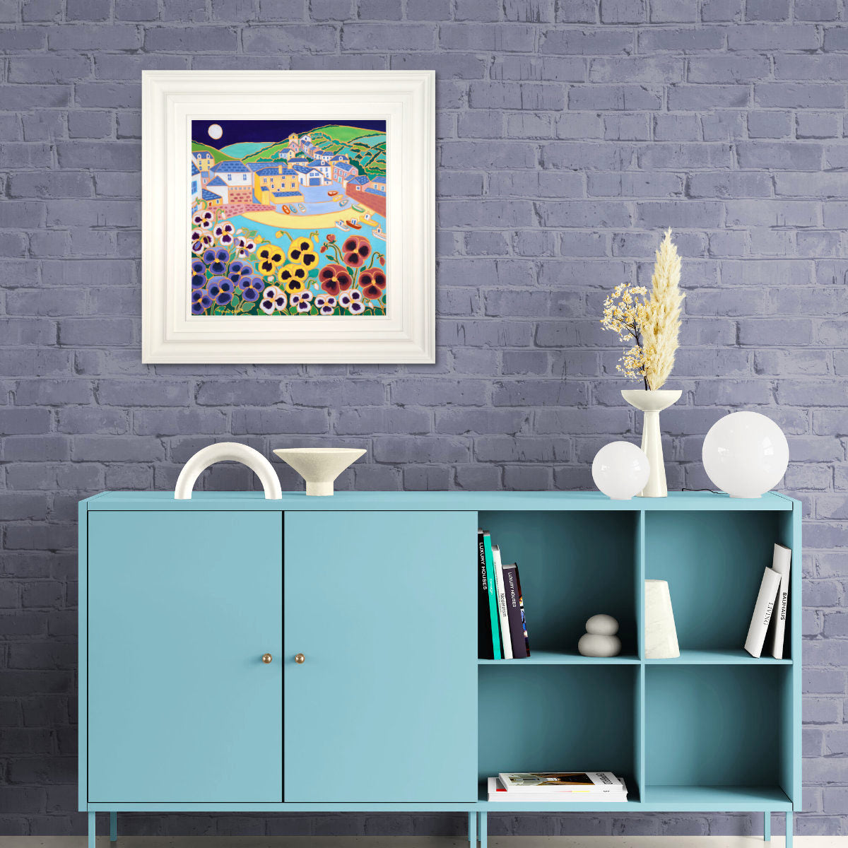 Teal cabinet with decorative items against a gray brick wall with a framed artwork. 'Moonlit Pansies on the Wall, Port Isaac',
18x18 inches oil on canvas. Painting by Cornish Artist Joanne Short