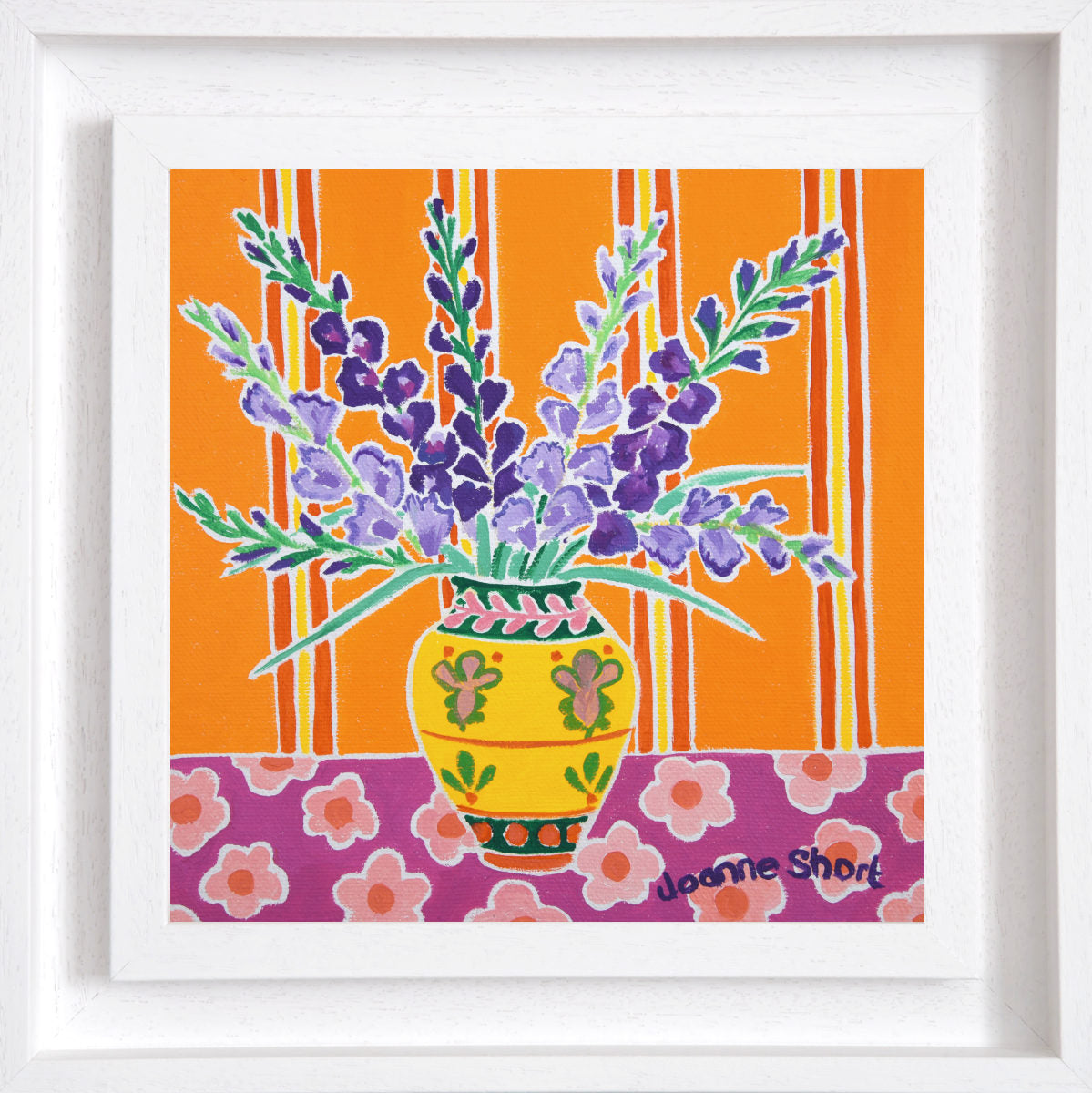 Framed artwork of a vase with purple flowers on an orange and pink floral background. 'Purple Gladioli in a Yellow Vase', 8 x 8 inches oil on canvas still life. Painting by Cornish Artist Joanne Short