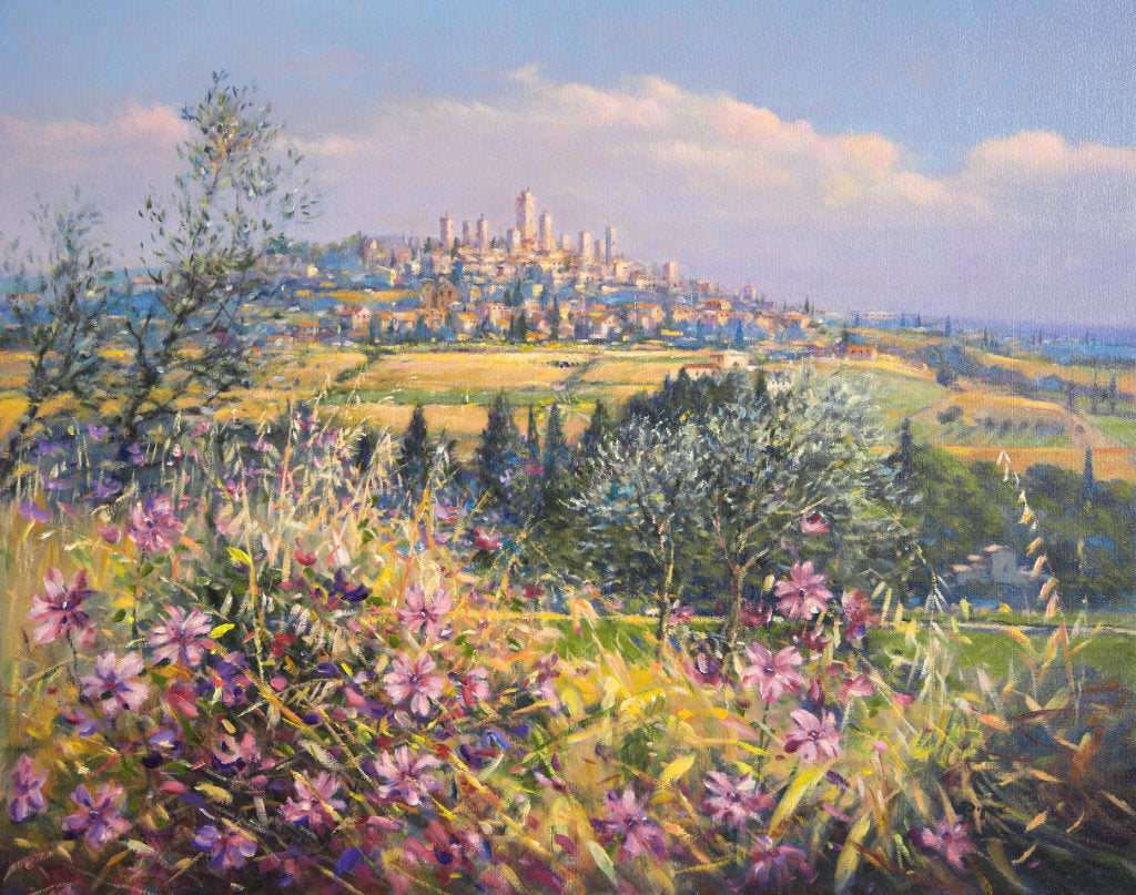 The painting brings the light, colours and textures of Italy to all who view. Wild flowers fill the foreground of the canvas and olive trees and pencil pines create a stage for the spectacular vista of the village of San Gimignano beyond. This painting is one that will bring the best of Tuscany and the best of Ted Dyer's art into your home. Perfect.