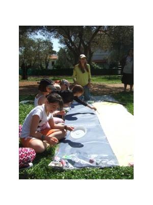 Joanne Short inspires French children to paint in her Olive Tree art workshop