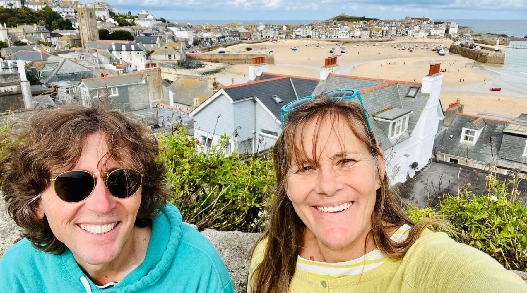 St Ives artists John Dyer and Joanne Short with the town of St Ives in Cornwall behind them