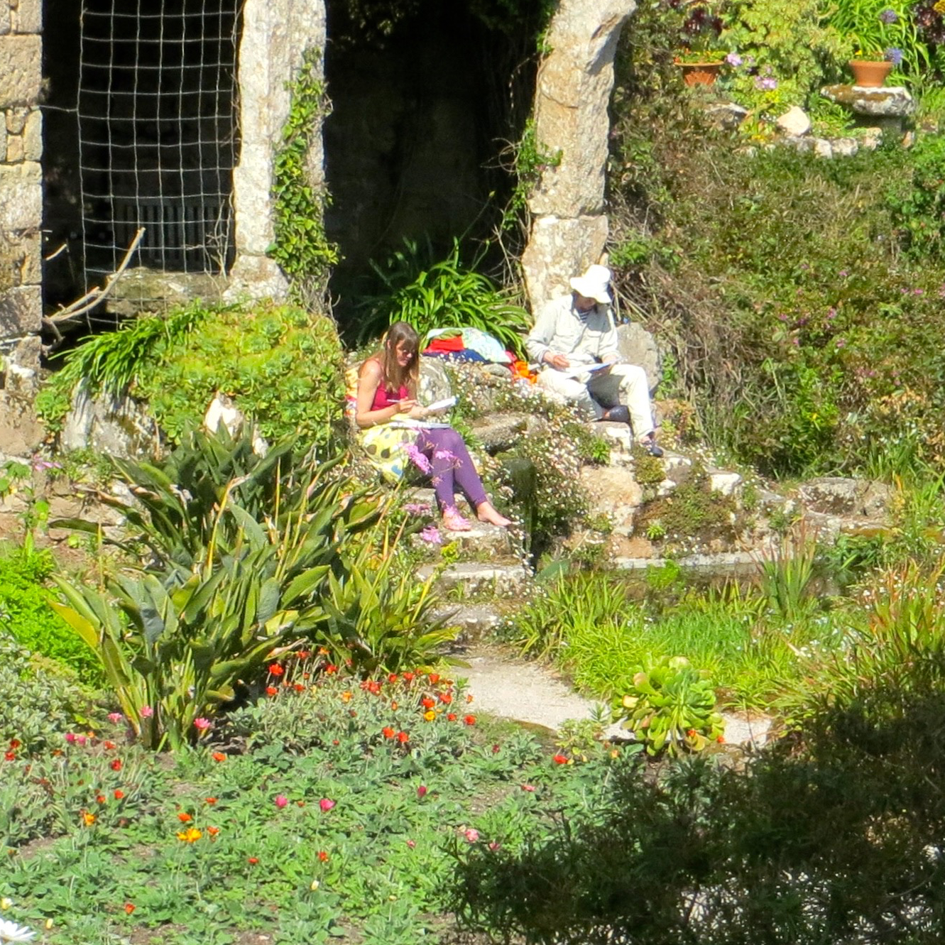 Cornish artists Joanne Short and John Dyer painting in the Tresco Abbey Gardens in Cornwall