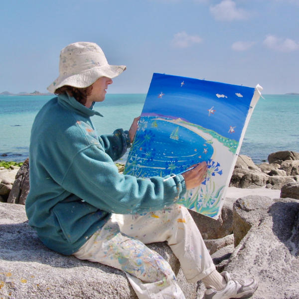 Cornish artist John Dyer painting a seascape painting in acrylic on the island of Tresco in Cornwall