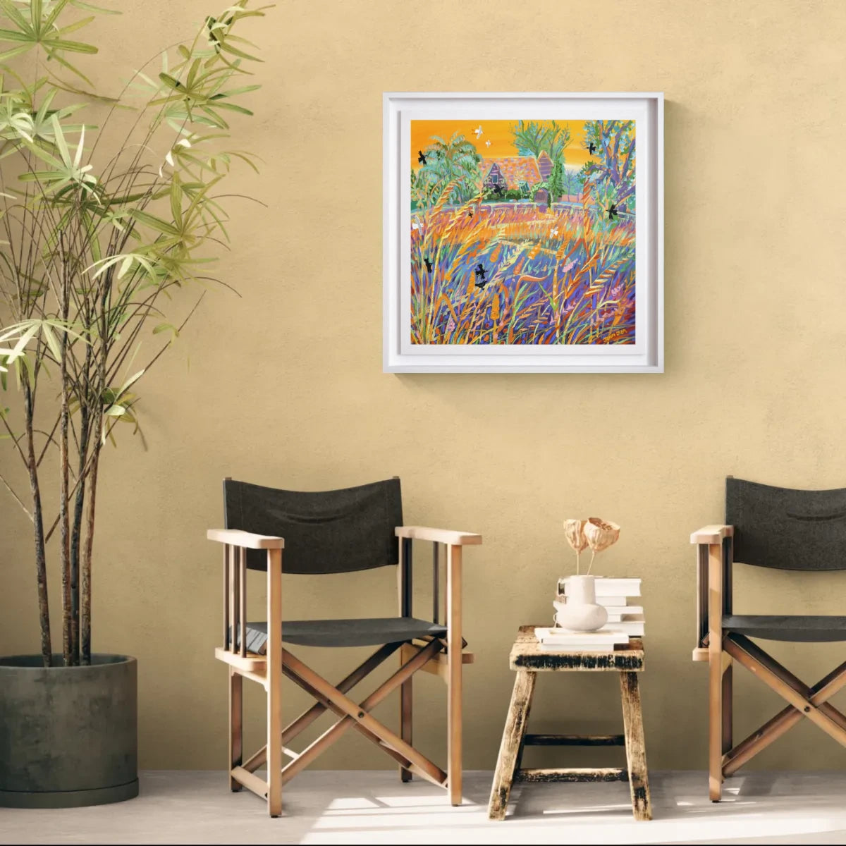 Two director's chairs in a room with a colorful painting on the wall. Original Painting by John Dyer. 'Sunset Grasses in the Breeze'. Kim Wilde's garden. 24 x 24 inches acrylic on canvas