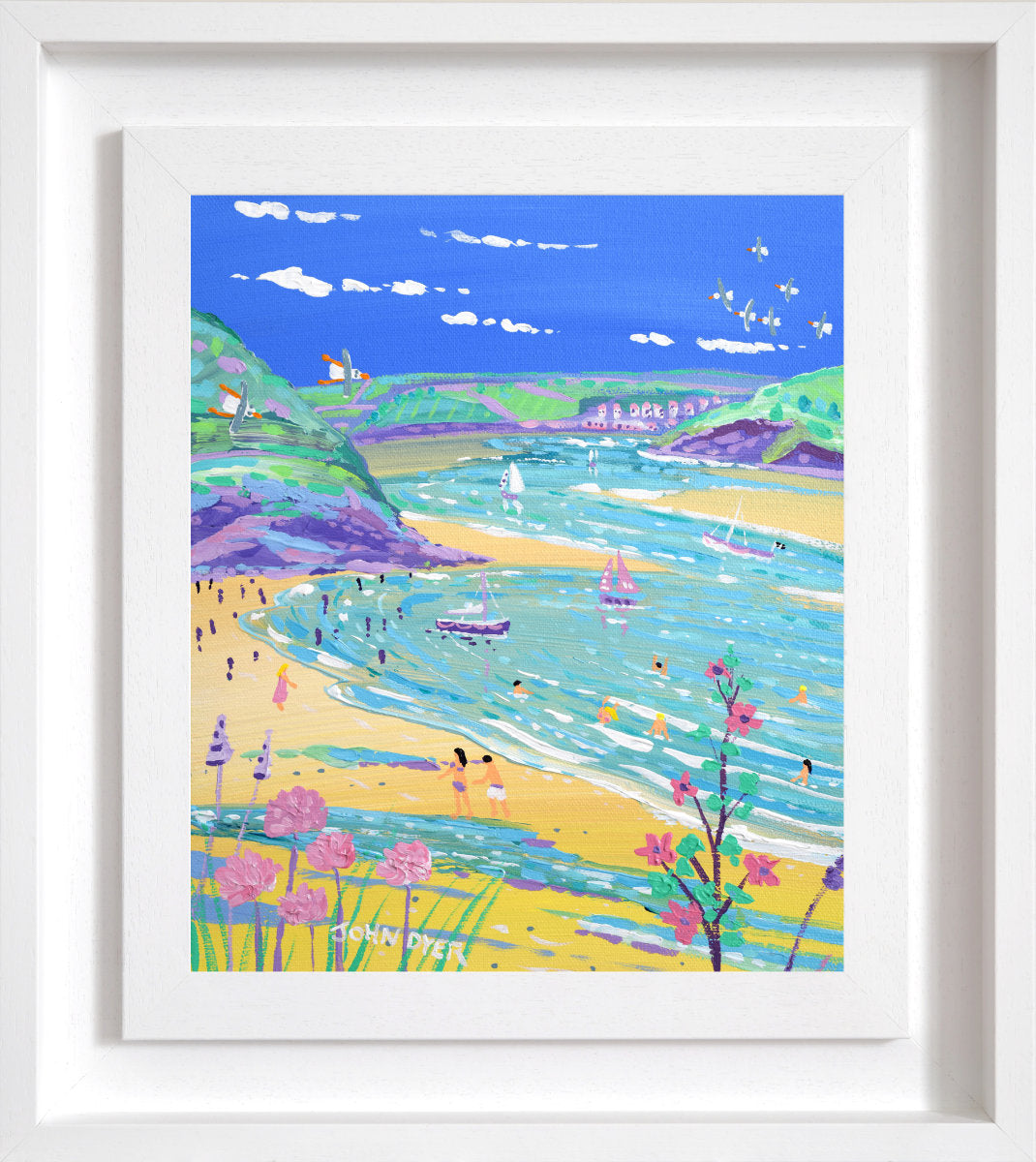 A framed art print depicting a vibrant coastal landscape with a blue sky, turquoise sea, sandy beach, and colourful hills, presented in a white frame. 'Watching the Tide come in, Daymer Bay, Rock', 12 x10 inches acrylic on canvas by Cornish Artist John Dyer