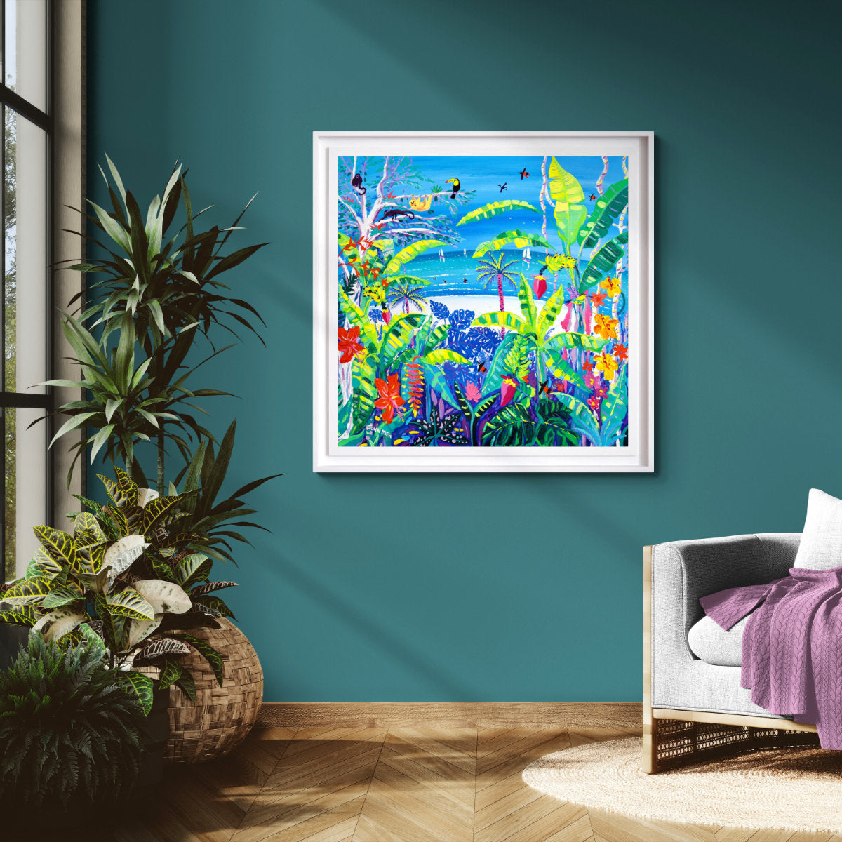 Colorful abstract painting on a teal wall with plants and a gray sofa. 'Tropical Banana Wildlife Beach, Costa Rica', 35.5 x 35.5 inches acrylic on canvas. John Dyer Painting of the Caribbean.