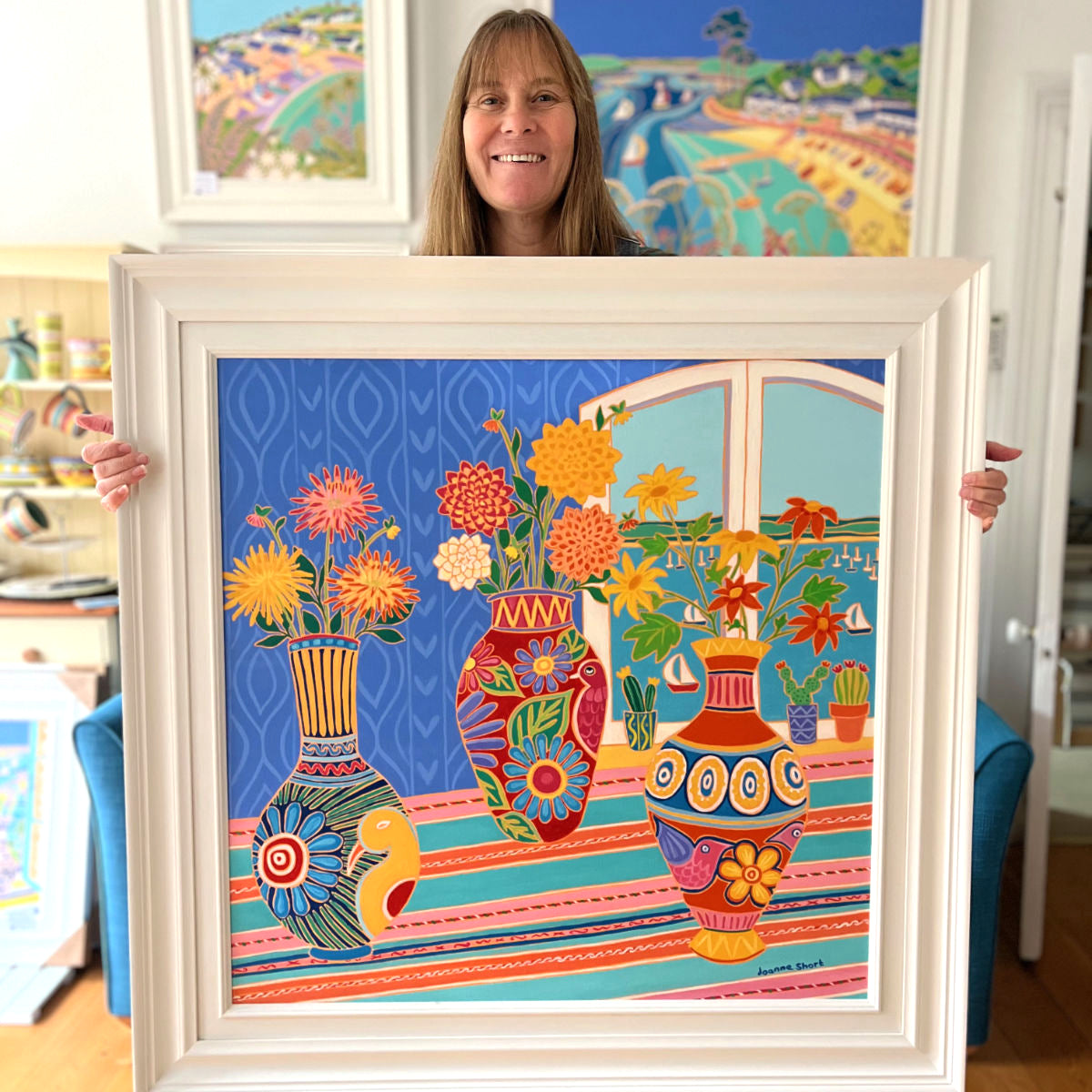 Cornish artist Joanne Short pictured at The John Dyer Gallery holding her &#39;Fiesta of Flowers in Mexican Vases&#39;, 30x30 inches oil on canvas