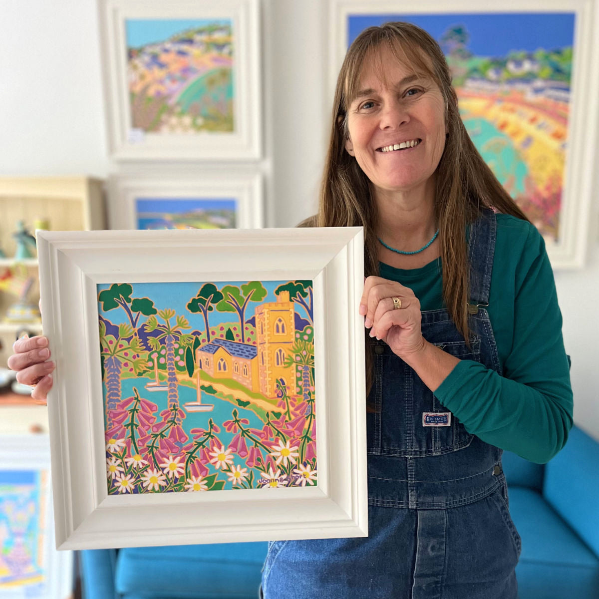 Cornish artist Joanne Short pictured holding her &#39;View through the Wildflowers, St Just in Roseland&#39;, 12x12 inches oil on canvas painting.