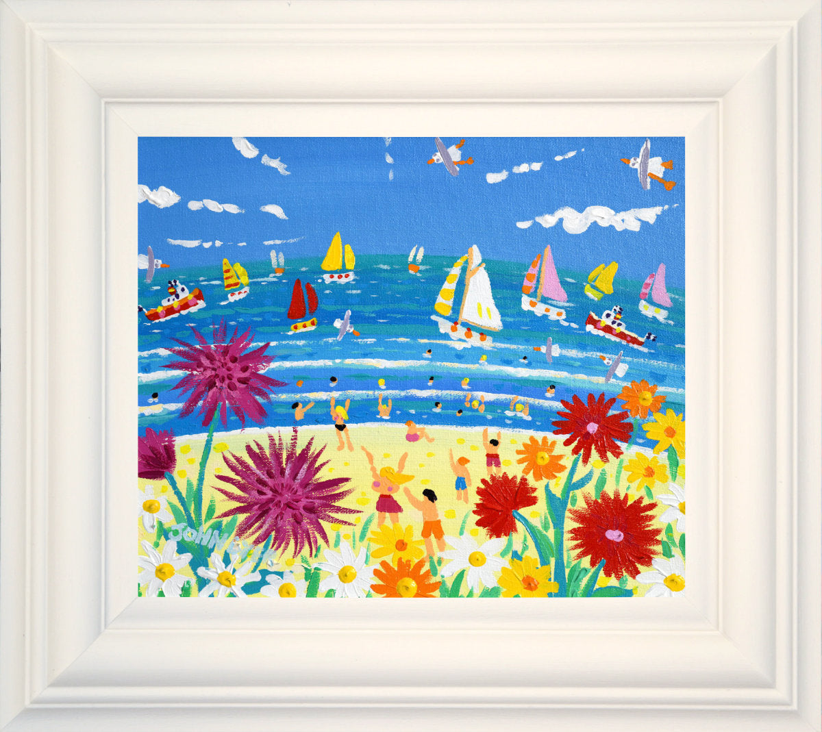 A colorful beach scene painting with sailboats on blue water, small figures of people on the sandy shore, and large flowers in the foreground under a bright blue sky. John Dyer Original Painting. ‘A Burst of Cornish Colour’. 10 x 12 inches acrylic on canvas