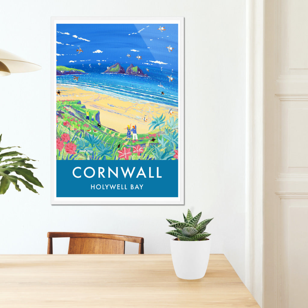 A vintage style seaside wall art poster print of Holywell Bay on the North coast of Cornwall by Cornish artist John Dyer. John used to live in Holywell Bay for 15 years and has a deep connection to the beach and dunes. Brilliant colour and type combine on this poster print with John&#39;s painting to create a perfect image of Holywell Bay and a wonderful vintage look for your home or office. Available now either unframed or framed and ready to hang.