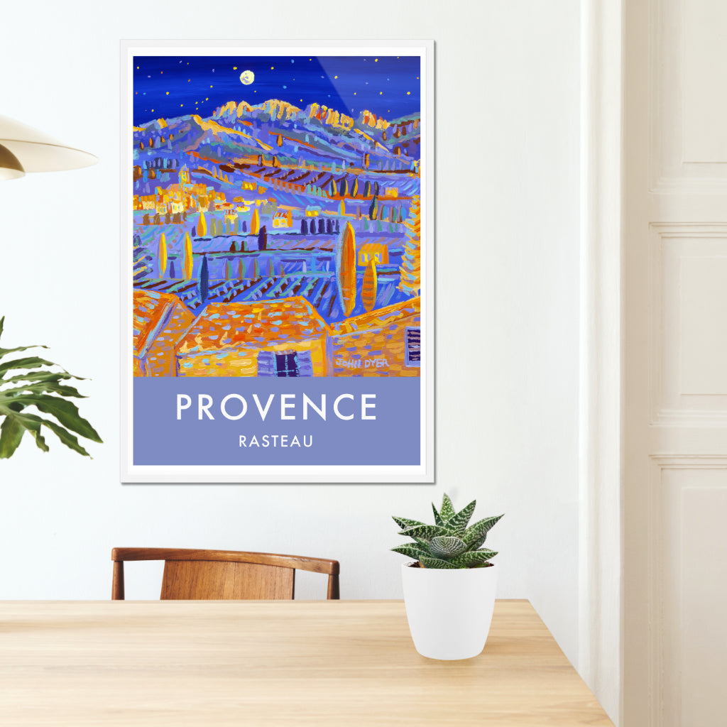 This travel art poster print of Provence features the amazing art of John Dyer and the view looking across the landscape of Provence from the village of Rasteau towards the wine producing villages of Séguret and Sablet. The Dentelles de Montmirail chain of mountains catch the moonlight in the distance set against a deep blue night sky. You can almost hear and smell the atmosphere of an August night in Provence from this art poster. Available framed or unframed