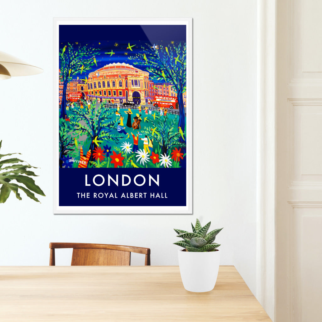 John Dyer&#39;s wall art poster print of London features &#39;Performing to the Parrots in the Park, Royal Albert Hall&#39; which makes for the perfect vintage style art poster print of London. Featuring Hyde Park &amp; the Royal Albert Hall the print is a complete celebration of London life &amp; culture with musicians performing flute and cello music to parrots in the park with black cabs &amp; London buses whizzing past. Fantastic! Available unframed or framed and ready to hang on your wall at home or work.