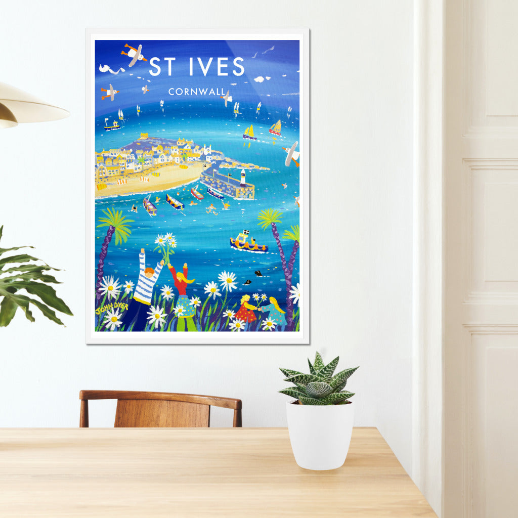 A wonderful John Dyer wall art poster print of St Ives in Cornwall with vintage style lettering and type. This colourful image by one of Cornwall&#39;s most famous artists is the perfect way to bring a touch of Cornish seaside magic into your home or office. Turquoise blue sea, summer flowers, Cornish fishing boats and all with John Dyer&#39;s famous flying seagulls. Available now either unframed or framed and ready to hang straight on your wall.