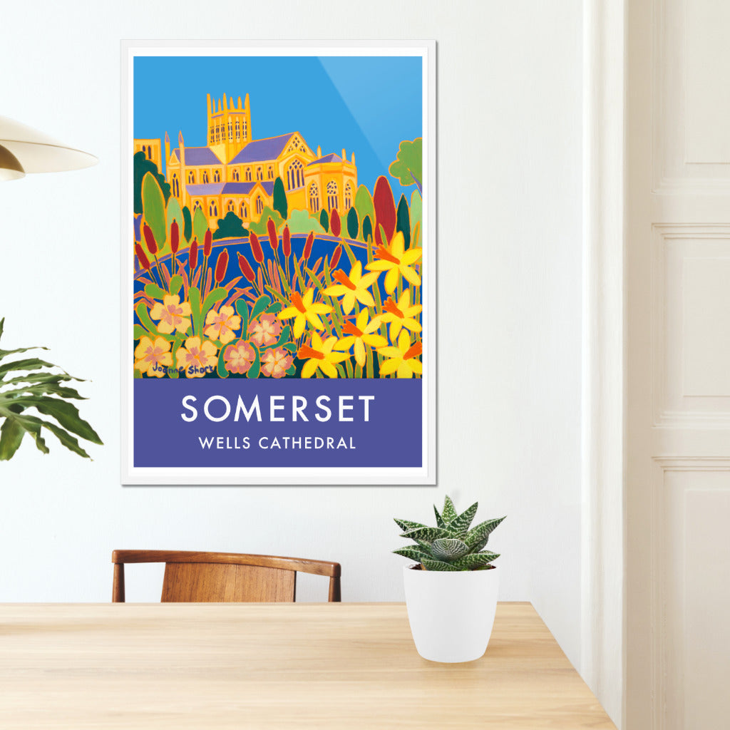 Framed wall art poster print of Wells Cathedral in Wells Somerset with spring flowers and daffodils by British artist Joanne Short. Wells in Somerset is one of England&#39;s most beautiful cities. Artist Joanne Short lives and works in Wells as well as from her studio in Cornwall.