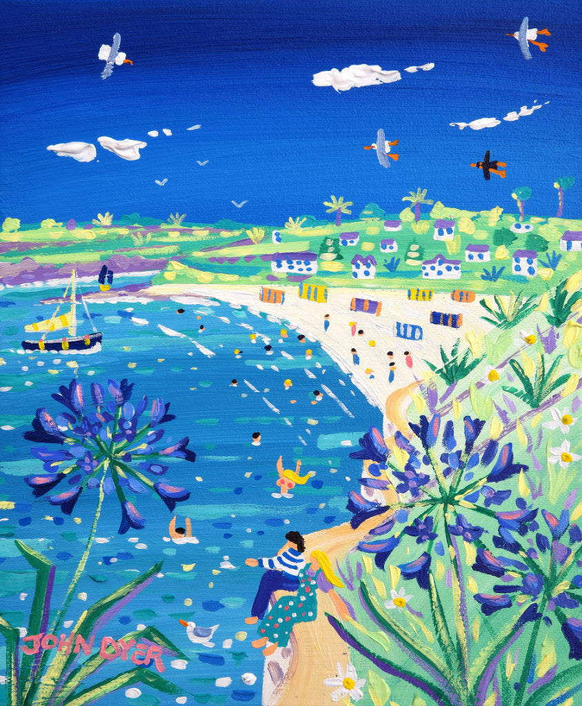 A delightful new painting by artist John Dyer featuring Gyllyngvase Beach in Falmouth. Relaxing blues, aquas combine on the canvas to describe the clear inviting water and the beautiful blue agapanthus flowers. A couple sit on the sea wall looking out to see and bathers, seagulls and sailing boats complete this idyllic scene. 