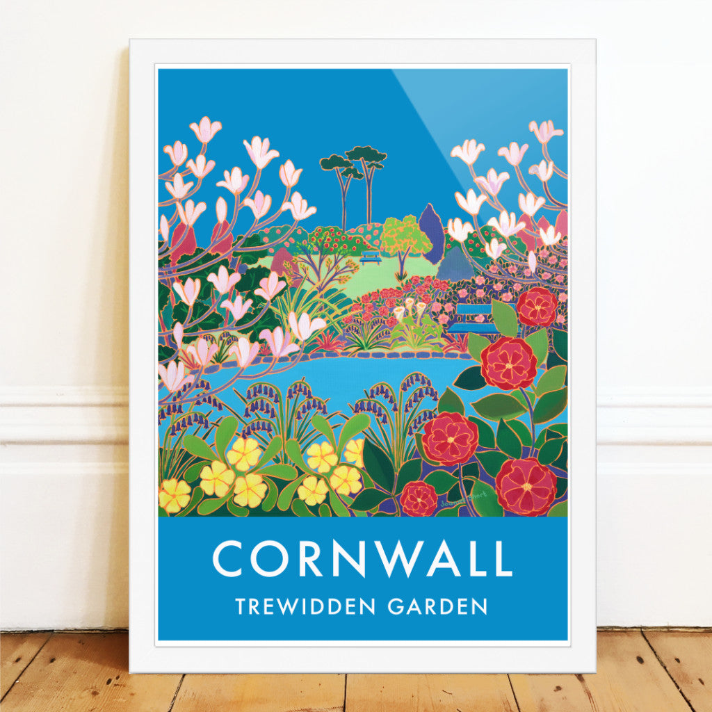 Cornwall wall art poster print of the Cornish garden of Trewidden near Penzance by Cornish artist Joanne Short. Trewidden Garden near Penzance in Cornwall commissioned Joanne Short to create this stunning picture of the glorious spring flowers &amp; landscape that makes this garden so special. The Peter Veitch Magnolia tree flowers against the perfect Cornish blue sky. Camellias, primroses &amp; bluebells surround the pond &amp; our eye is drawn through the picture to the garden benches and the tranquility they evoke.