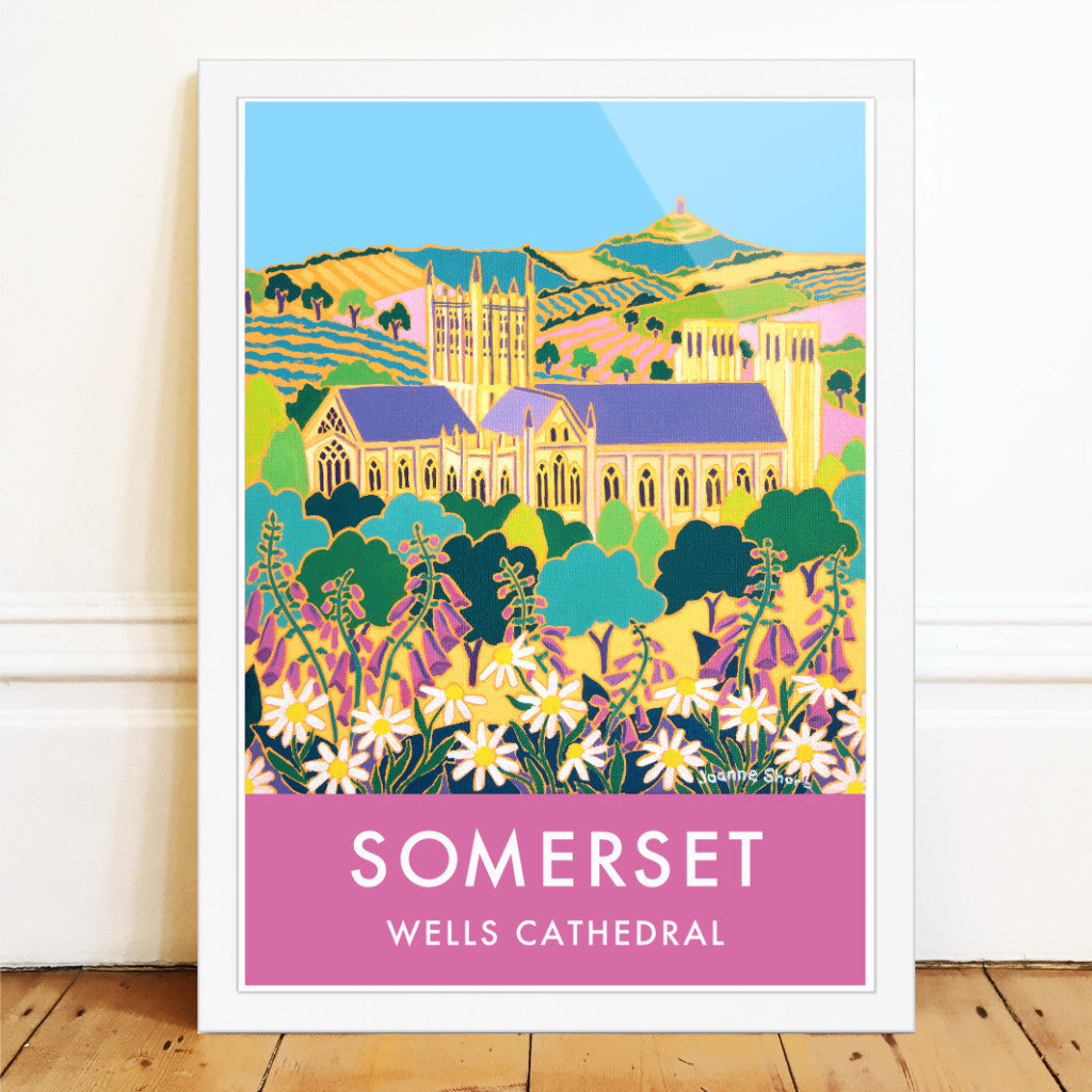 Wall art poster print of Wells Cathedral, Glastonbury Tor and the Somerset landscape by artist Joanne Short with pink foxgloves and wildflowers. A wonderful image of the Somerset landscape looking through wildflowers towards Wells Cathedral and then Glastonbury Tor beyond. Artist Joanne Short&#39;s painting &#39;Springtime Flowers, Wells&#39; is beautifully reproduced on this vintage style travel art poster and is available framed or unframed in a range or sizes to fit your home or office.