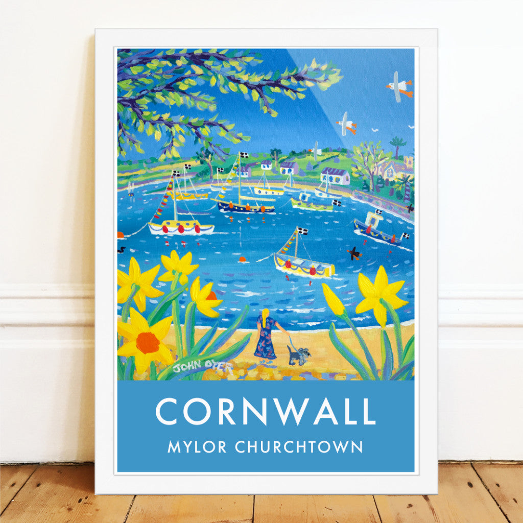 Cornish spring daffodils are set against a wonderful blue sea in this vintage style wall art poster print featuring a painting by artist John Dyer of Mylor Churchtown and Harbour in Cornwall. The church at Mylor can be seen on the right side. Cornish boats bob in the harbour and the lime greens of the new foliage on the trees gives this piece a real sense of energy and light.