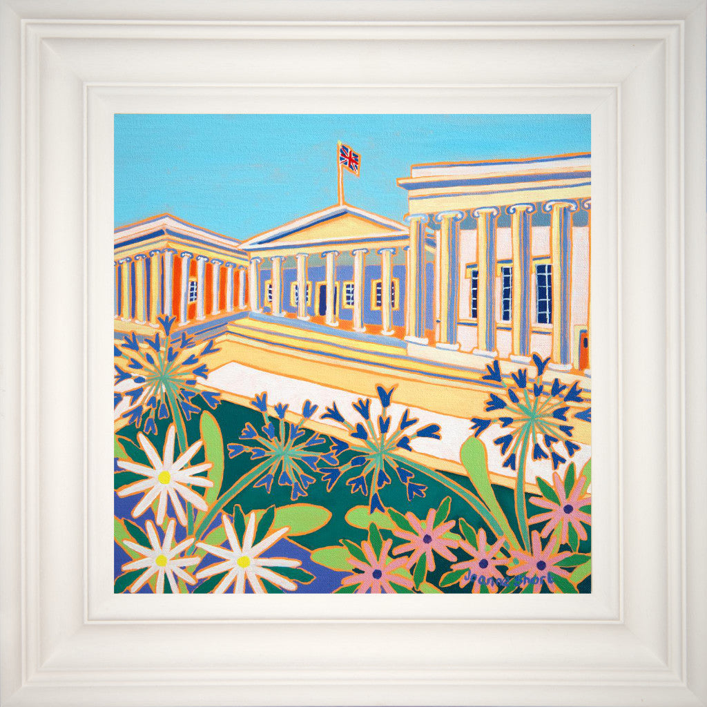 Agapanthus &amp; daisies create the foreground for the grandeur of the UK&#39;s most visited attraction, The British Museum in London. Captured beautifully in this Joanne Short painting. A Union Jack flag flutter against the summer blue sky &amp; the columns along the front of the museum catch the summer sunshine. The painting is featured as part of The British Museum&#39;s new &#39;Joanne Short London Collection&#39;.